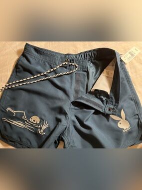 Playboy by pacsun ( new with tags).  Navy blue men’s swim trunks.
